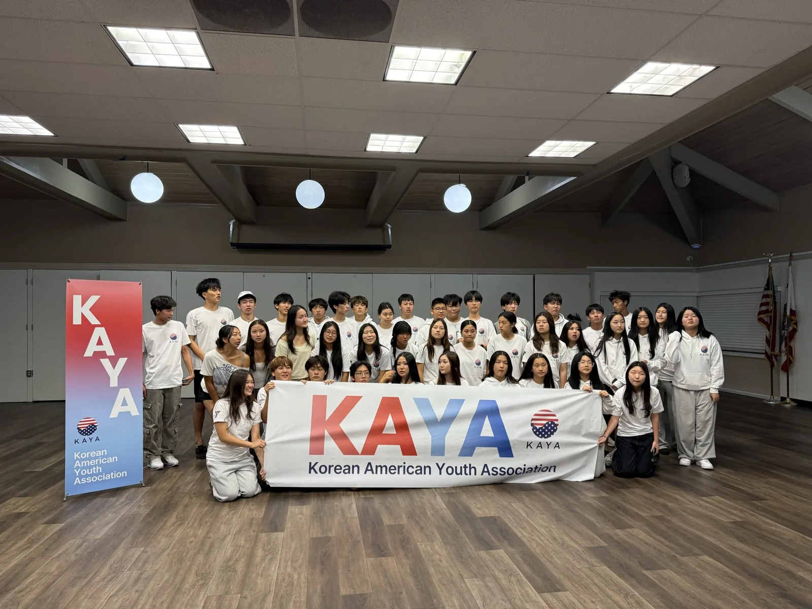 KAYA members with the group banner