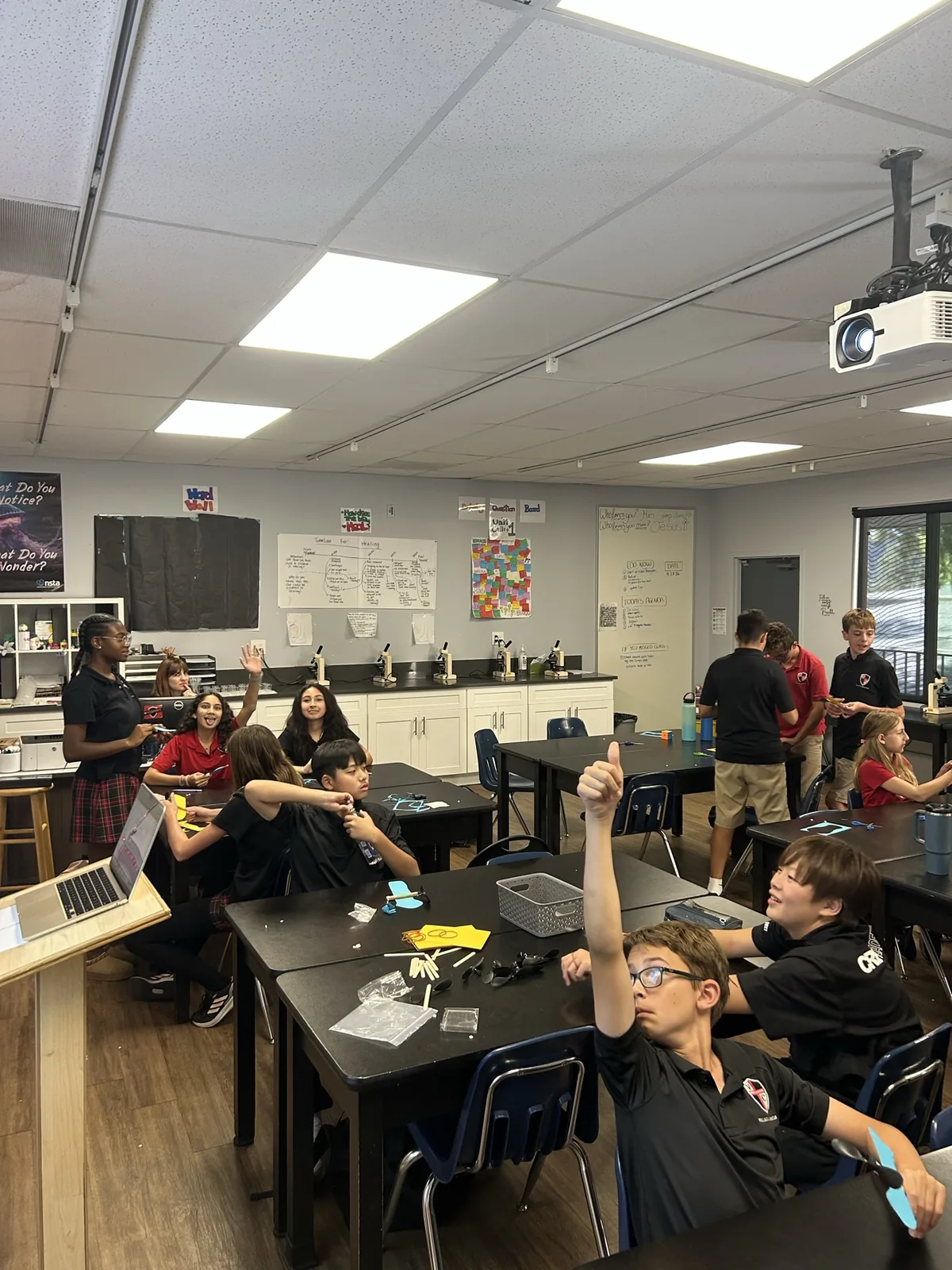 Classmates around the activity tables