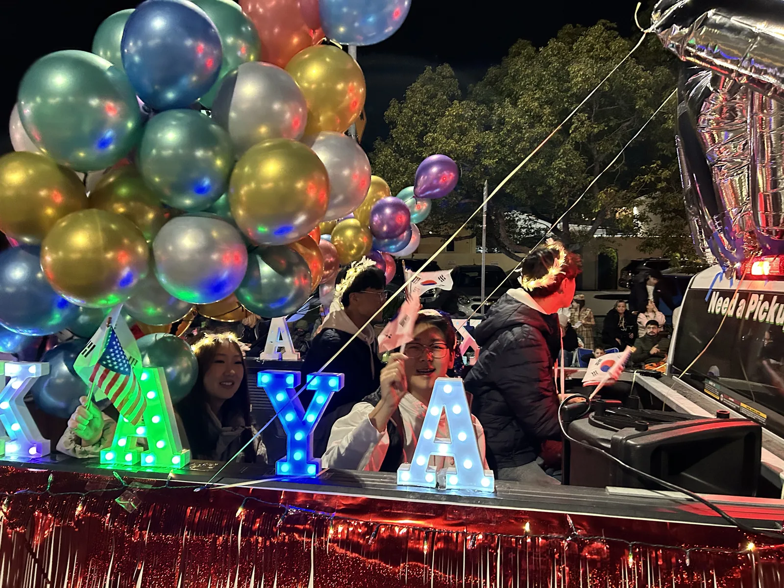 Flags, balloons, and lights on the KAYA float